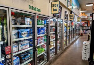 A store with a lot of beer on the shelves.